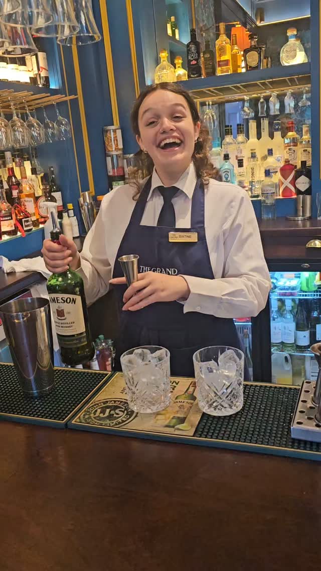 The newly renovated Marksman Bar at The Grand Hotel Malahide welcomes locals and travelers alike with a cozy, speakeasy feel and window to the bay. Sixtine, our bartender is a natural mixologist, juggler of drinks  and a happy hearted people person.
Love the blue and gold trim and intricate patterned wallpaper and deep cushioned seating. Toby Keith would say, "I love this bar". #couplesgoals #malahidegrandhotel #greengolfball #bar #instaireland_